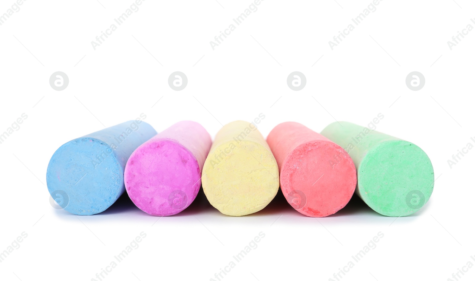 Photo of Color pieces of chalk on white background