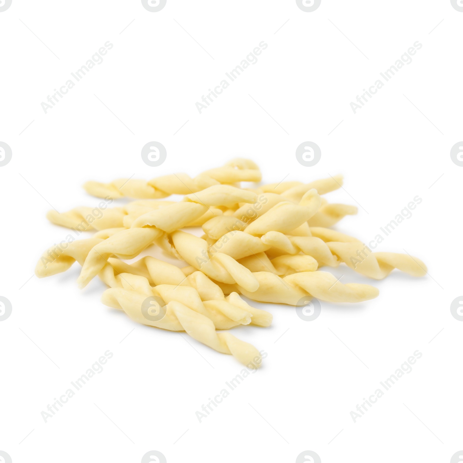 Photo of Pile of uncooked trofie pasta isolated on white