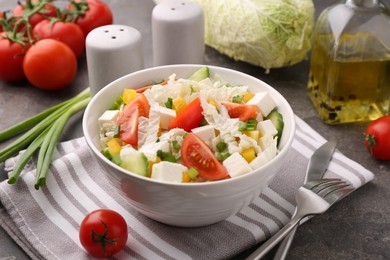 Photo of Tasty salad with Chinese cabbage served on grey table