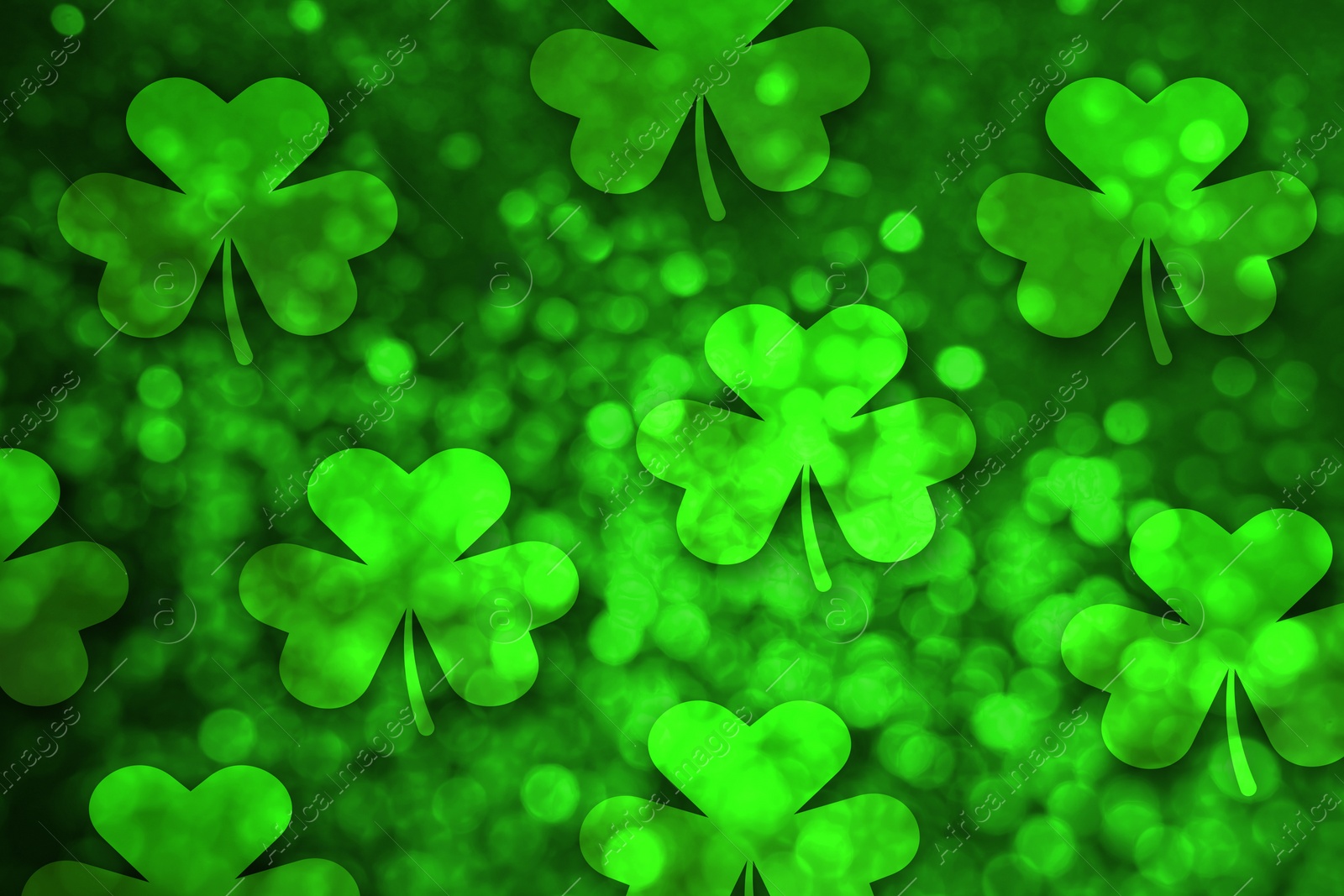 Image of St. Patrick's Day celebration. Clover leaves on green background, bokeh effect