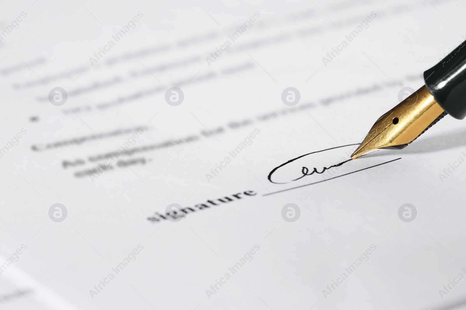 Photo of Signing notary document with fountain pen, closeup