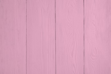 Photo of Texture of pink wooden surface as background, closeup