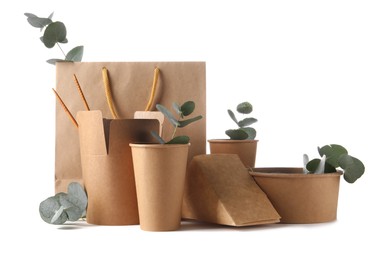 Eco friendly packaging. Disposable food containers, paper bag and eucalyptus leaves isolated on white