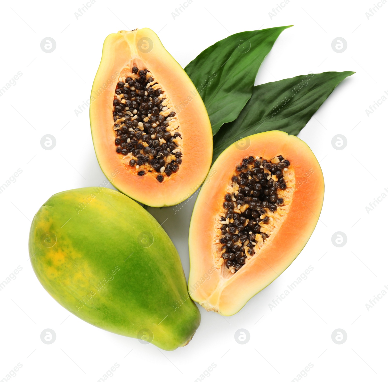 Photo of Fresh ripe papaya fruits with green leaves on white background, top view