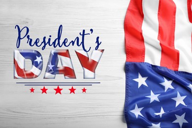 Happy President's Day - federal holiday. American flag and text on white wooden background, top view