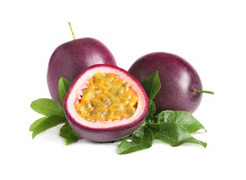 Photo of Cut and whole passion fruits with leaves isolated on white