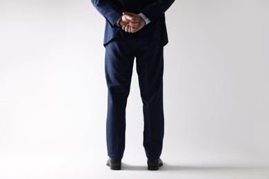 Businessman in leather shoes on white background, closeup