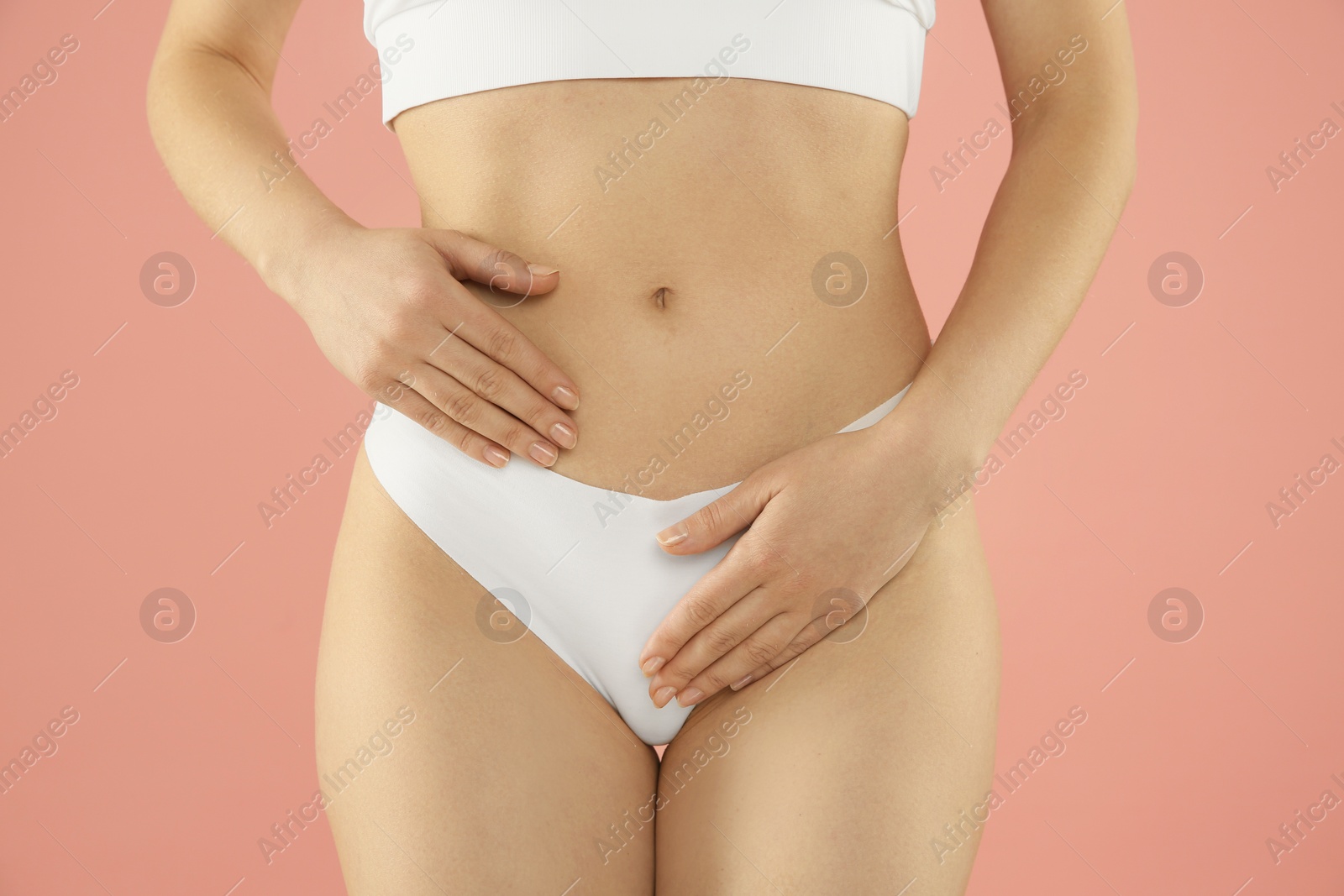 Photo of Gynecology. Woman in underwear on pink background, closeup