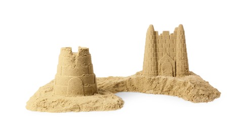 Photo of Pile of sand with beautiful castles isolated on white