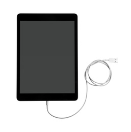 Tablet and USB charge cable on white background, top view