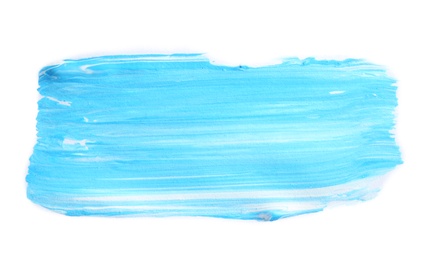 Photo of Abstract brushstroke of blue paint isolated on white