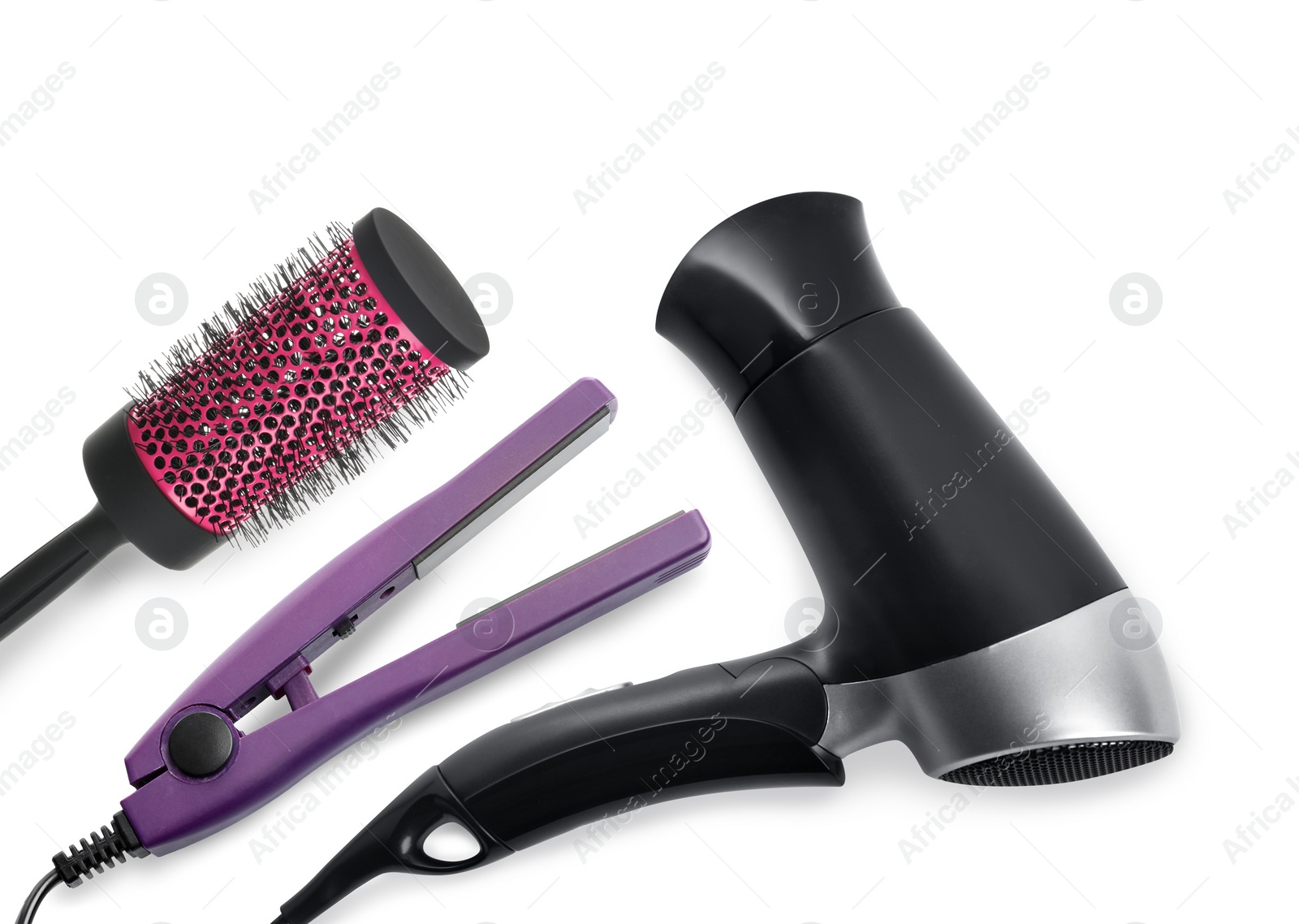 Image of Hair dryer, straightener and round brush on white background