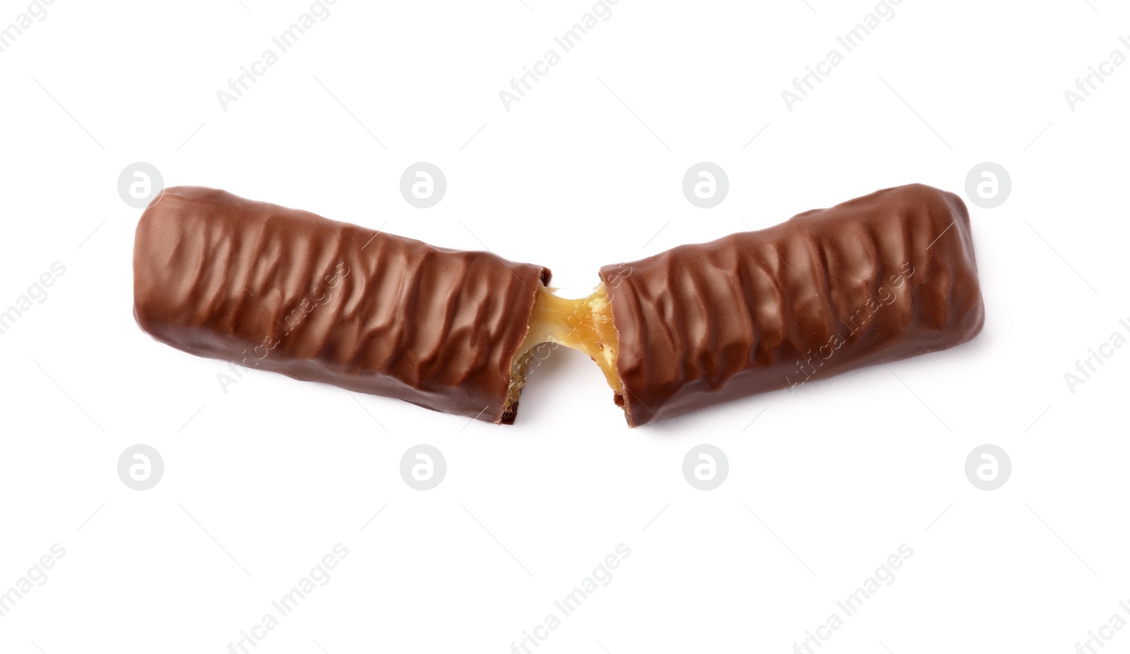 Photo of Pieces of chocolate bar with caramel on white background, top view