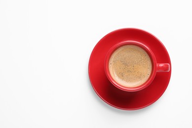 Red ceramic cup with hot aromatic coffee isolated on white, top view