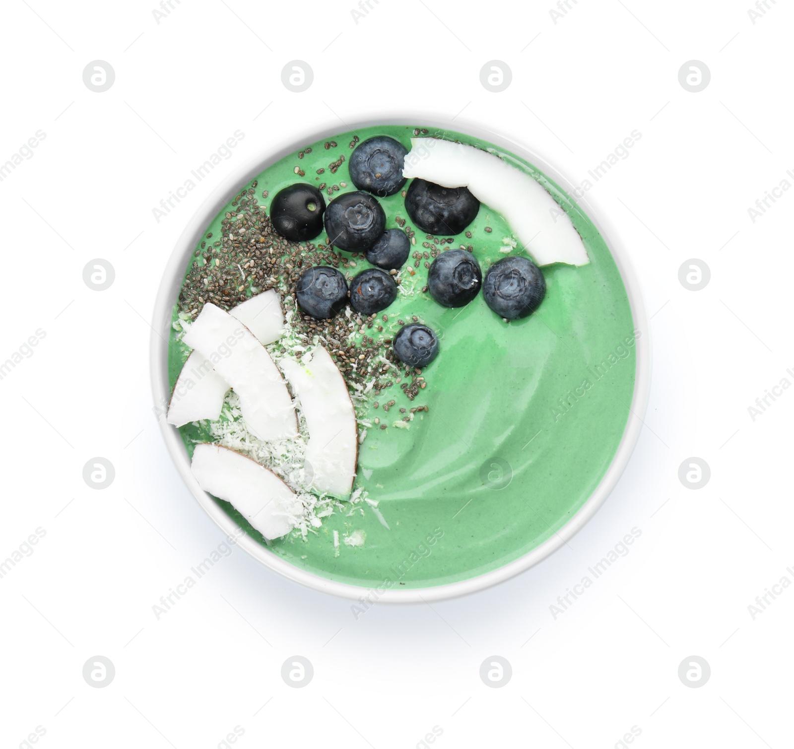 Photo of Bowl of spirulina smoothie with blueberries, coconut and chia seeds isolated on white, top view