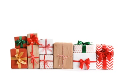 Photo of Beautifully wrapped gift boxes on white background