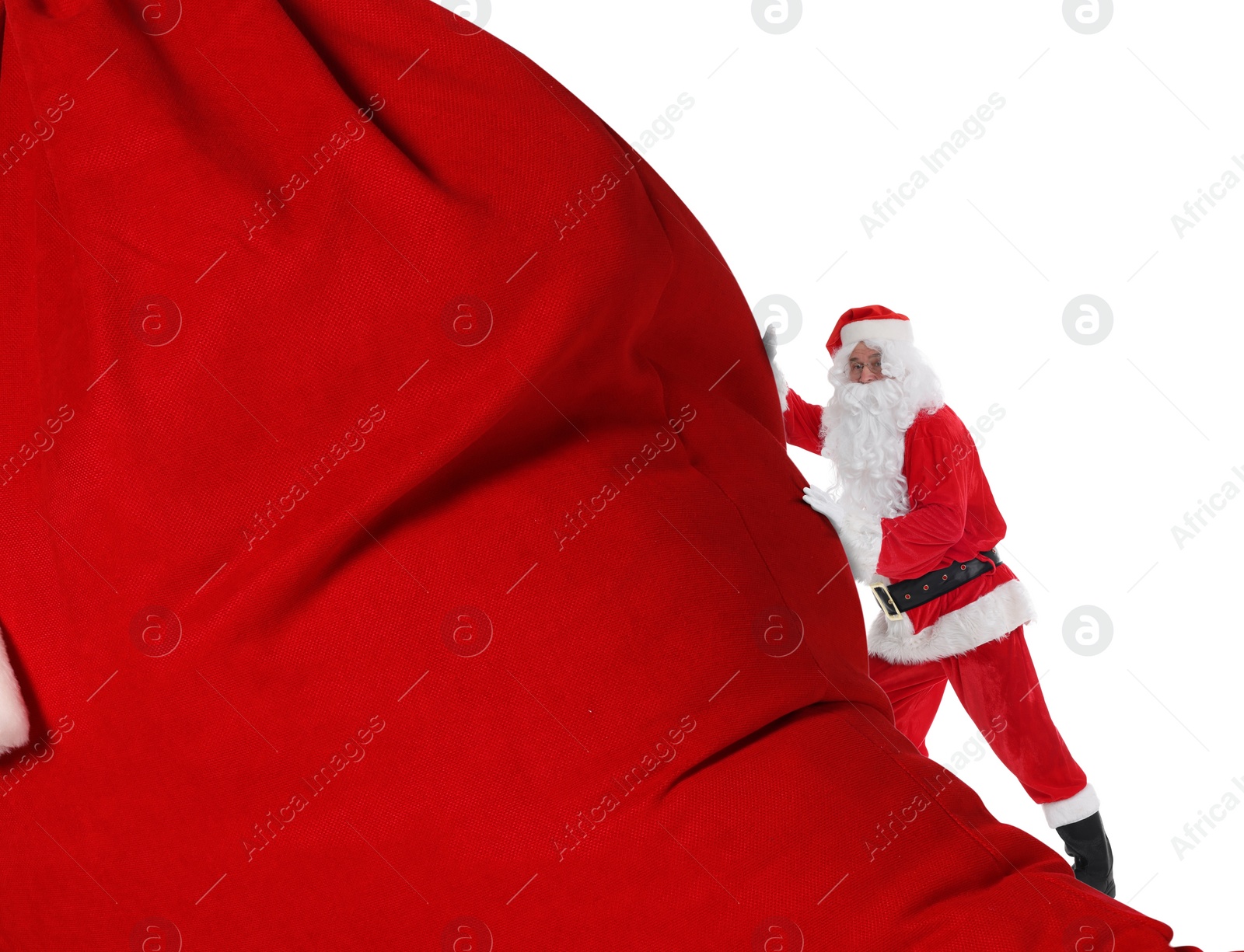 Image of Santa Claus with big red bag full of Christmas presents on white background