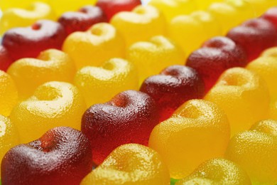 Photo of Delicious gummy cherry candies as background, closeup