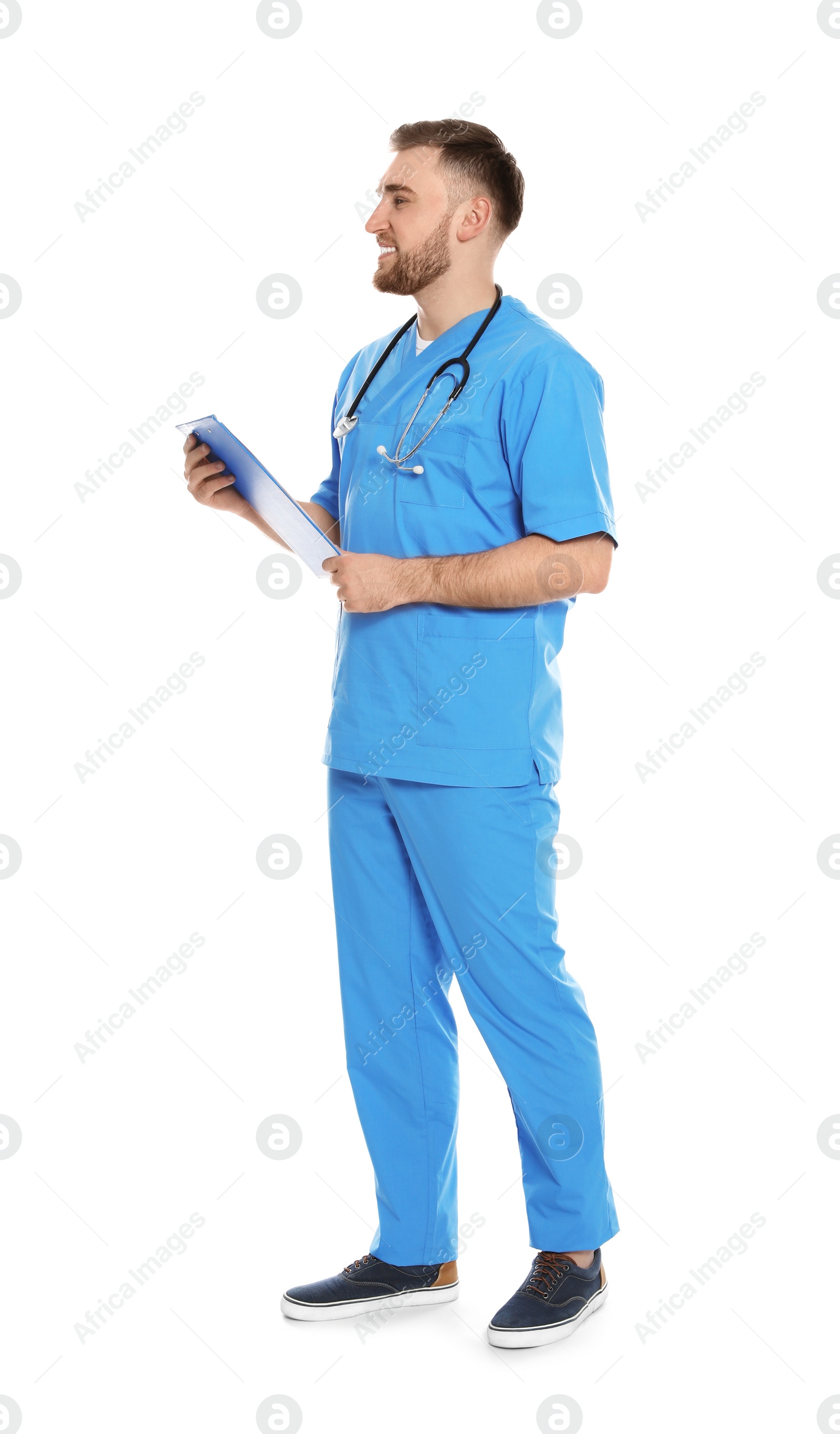 Photo of Full length portrait of medical doctor with clipboard and stethoscope isolated on white