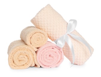 Photo of Rolled clean soft towels isolated on white