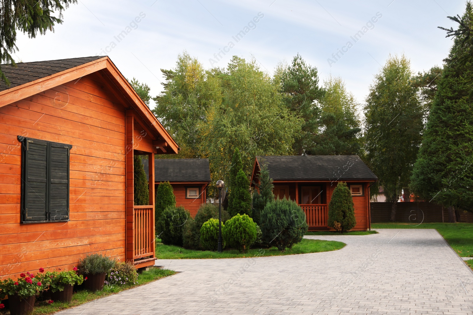 Photo of Beautiful cottage houses outdoors. Real estate for rent