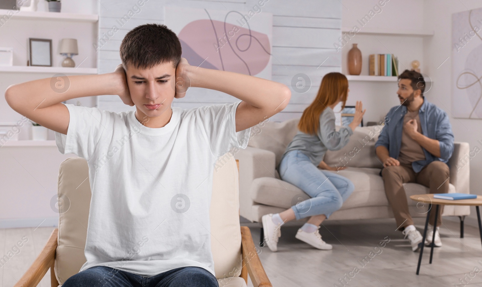 Photo of Unhappy teenage boy covering ears while his parents arguing on background. Problems at home