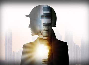 Image of Engineer in hard hat and cityscapes, multiple exposure