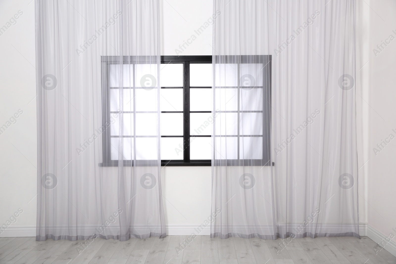 Photo of Modern window with glass and curtains in room. Home interior