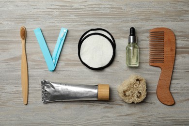 Photo of Flat lay composition with eco friendly products on wooden background. Conscious consumption
