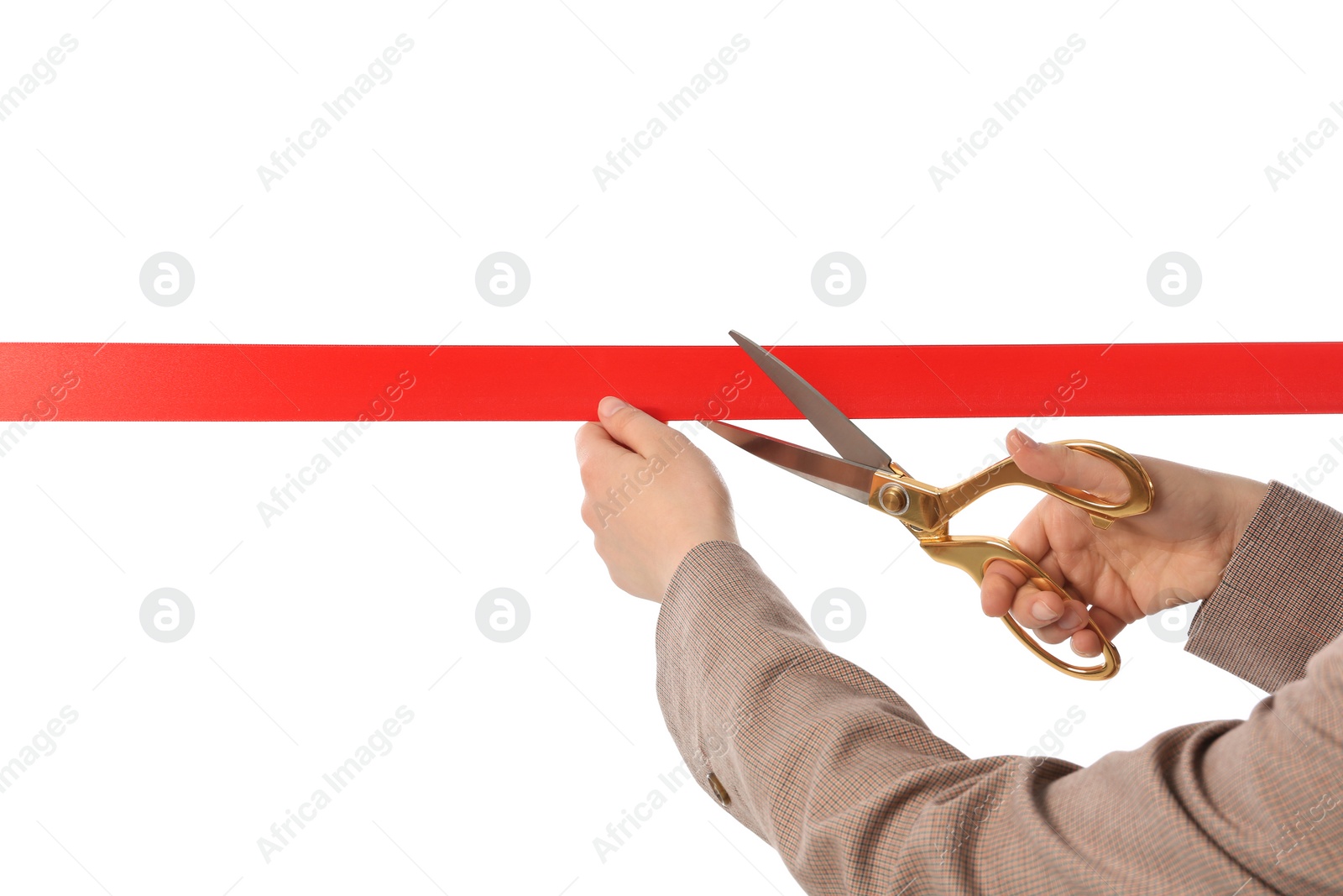 Photo of Woman in office suit cutting red ribbon isolated on white, closeup