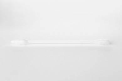 Photo of One clean cotton bud isolated on white