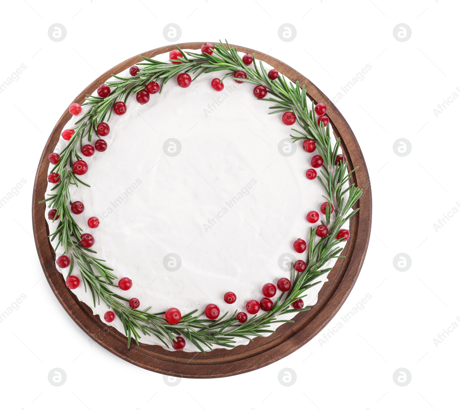 Photo of Traditional Christmas cake decorated with rosemary and cranberries isolated on white, top view