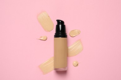 Liquid foundation and swatches on pink background, top view