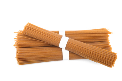 Photo of Uncooked buckwheat noodles isolated on white, top view