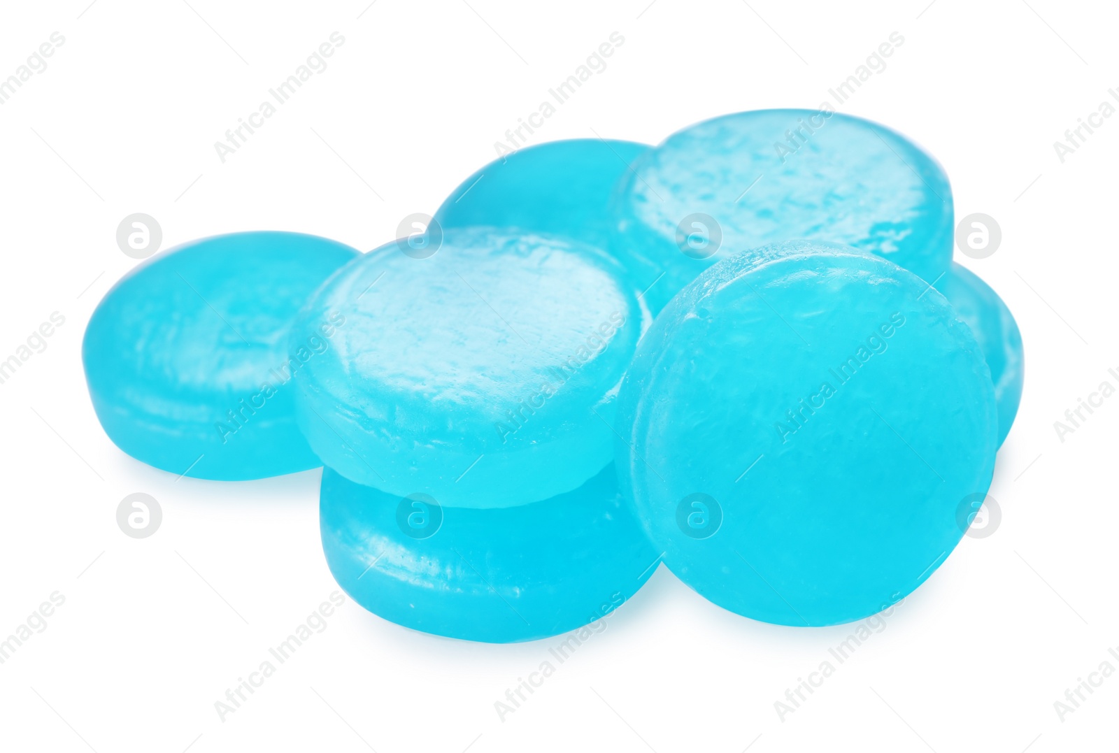 Photo of Many light blue cough drops on white background