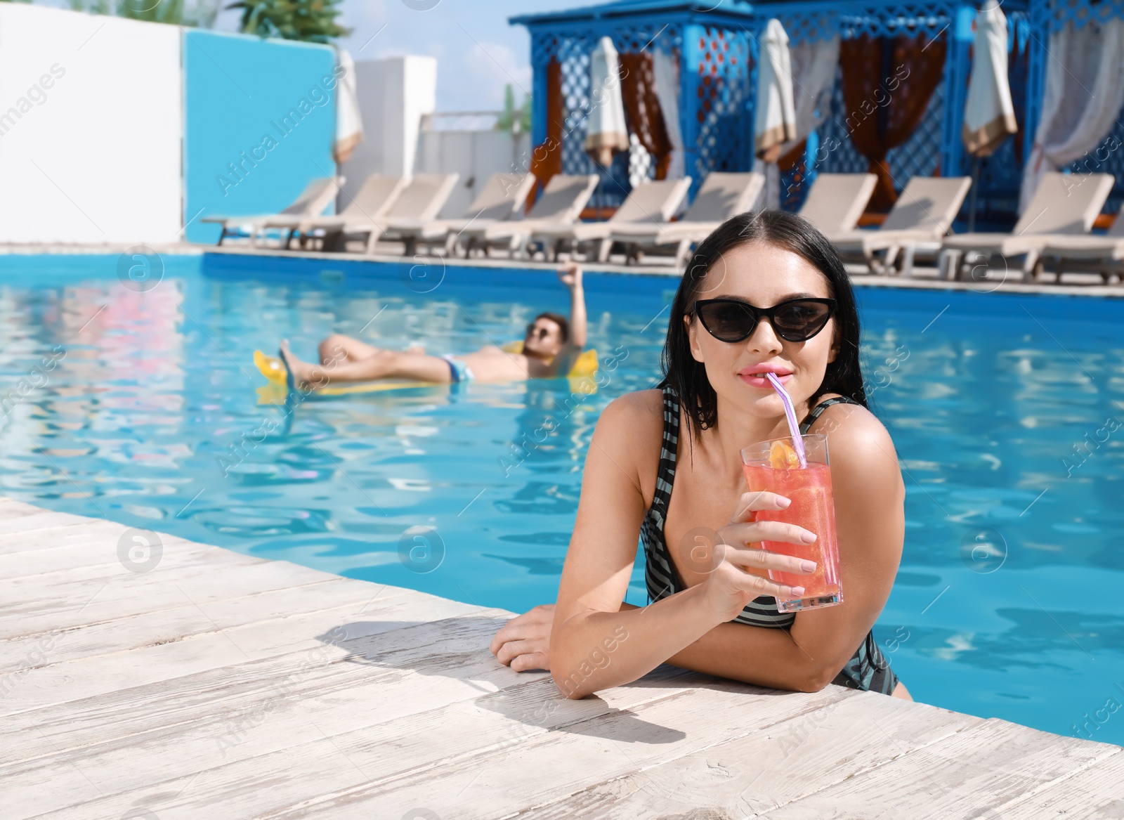 Photo of Happy young couple at resort on sunny day