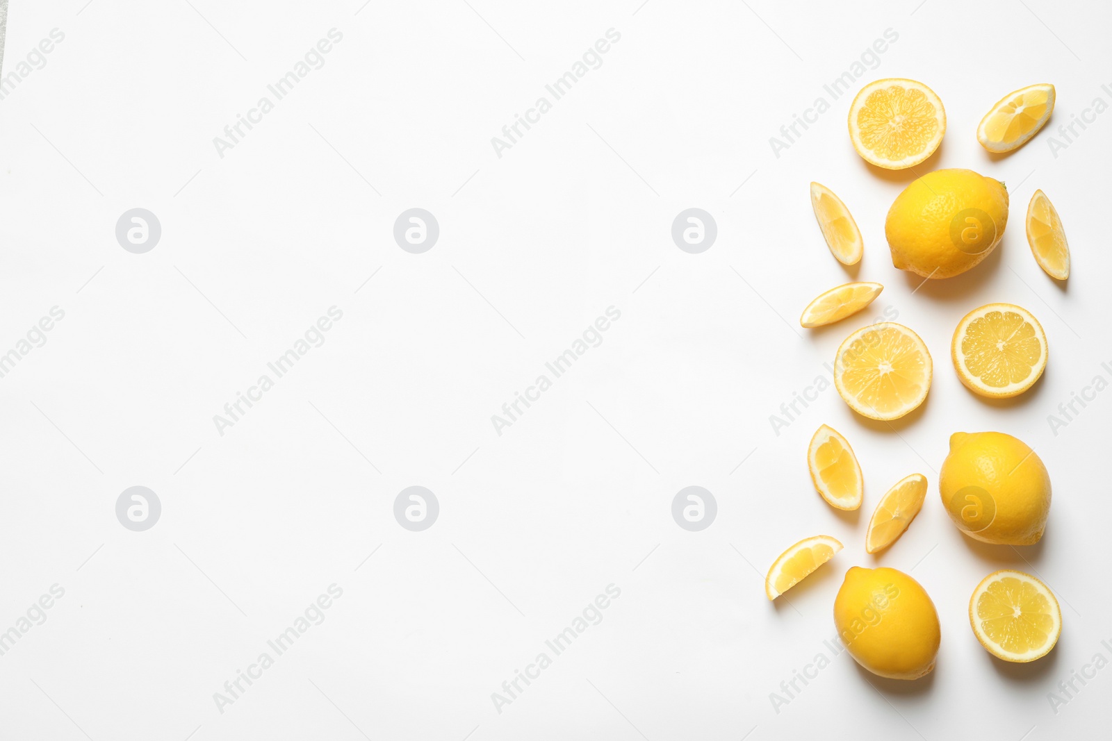 Photo of Fresh lemons on white background, top view. Citrus fruits