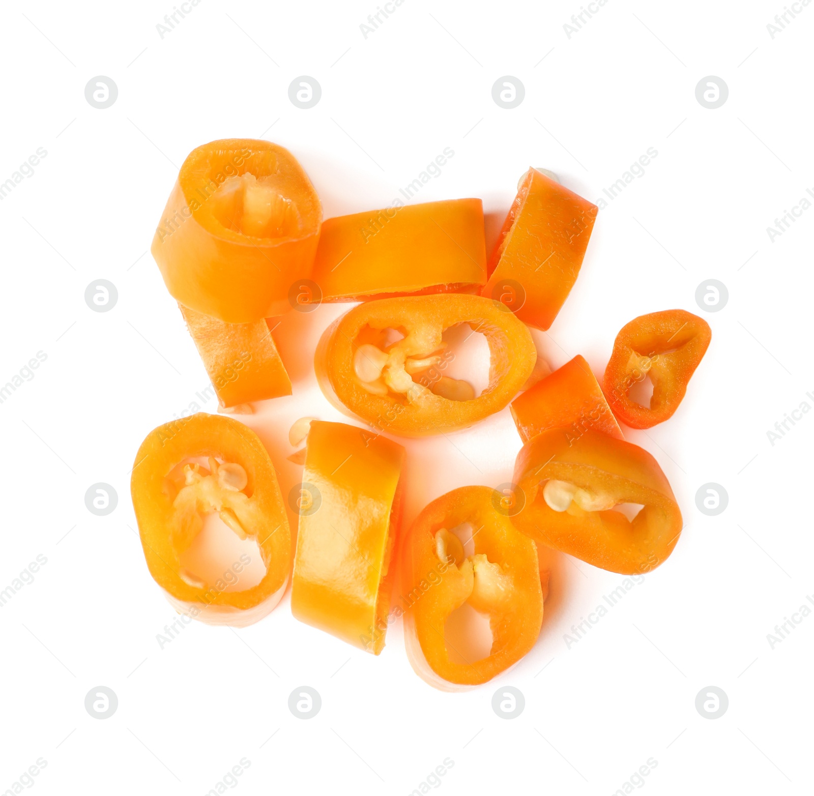 Photo of Pile of cut yellow hot chili peppers on white background, top view