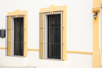 Photo of Building with beautiful windows and steel grilles