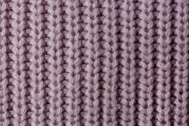 Beautiful violet knitted fabric as background, top view