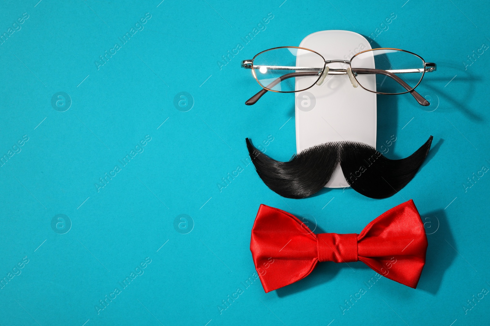 Photo of Flat lay composition with artificial moustache and glasses on light blue background, space for text