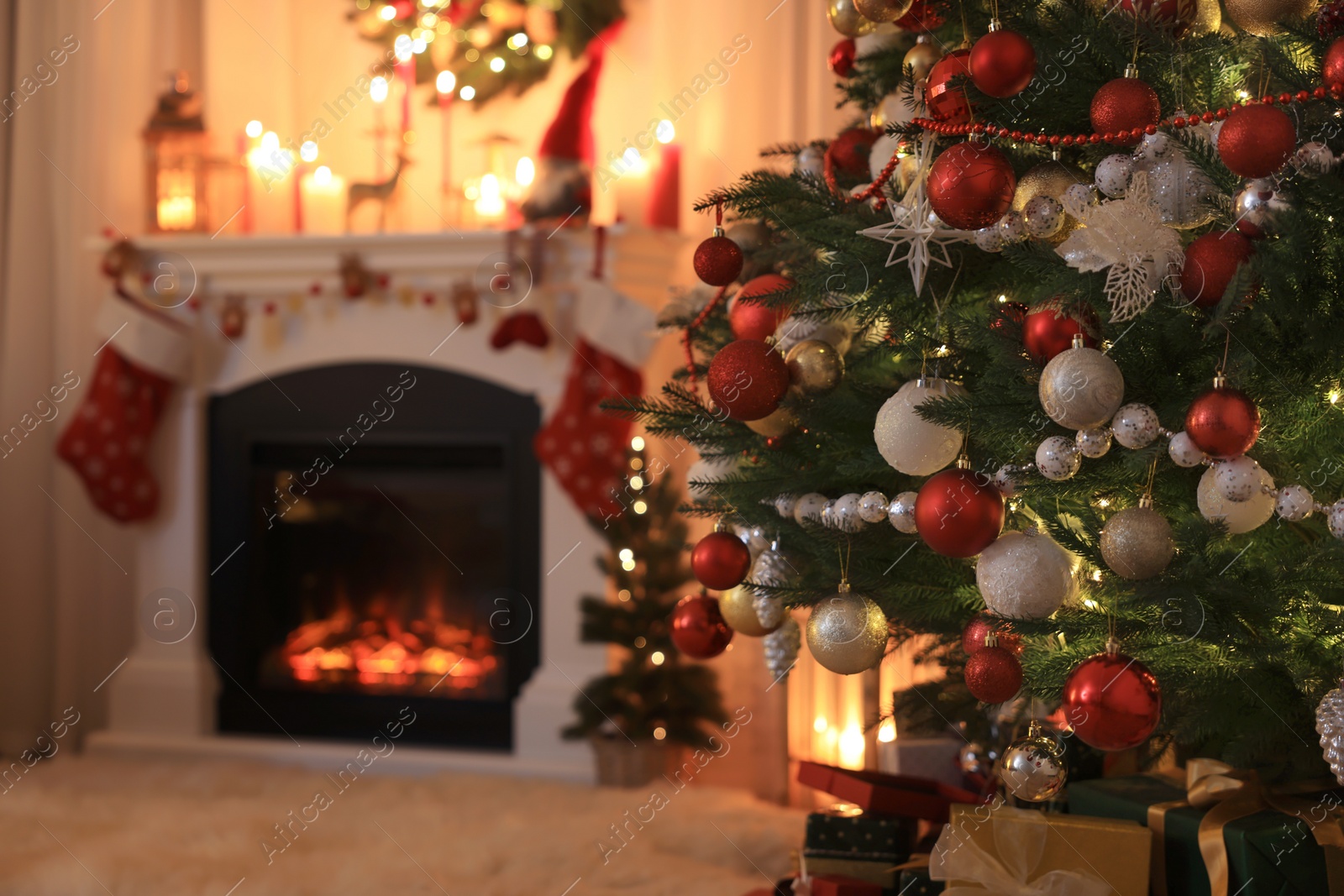 Photo of Festive living room interior with Christmas tree near fireplace