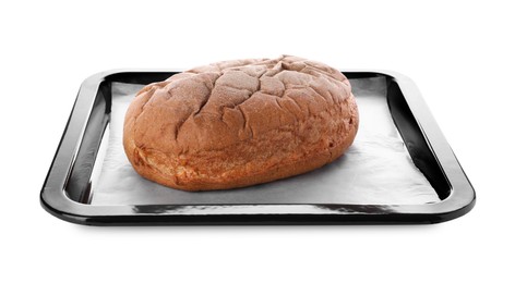 Photo of Baking pan with parchment paper and tasty bread isolated on white