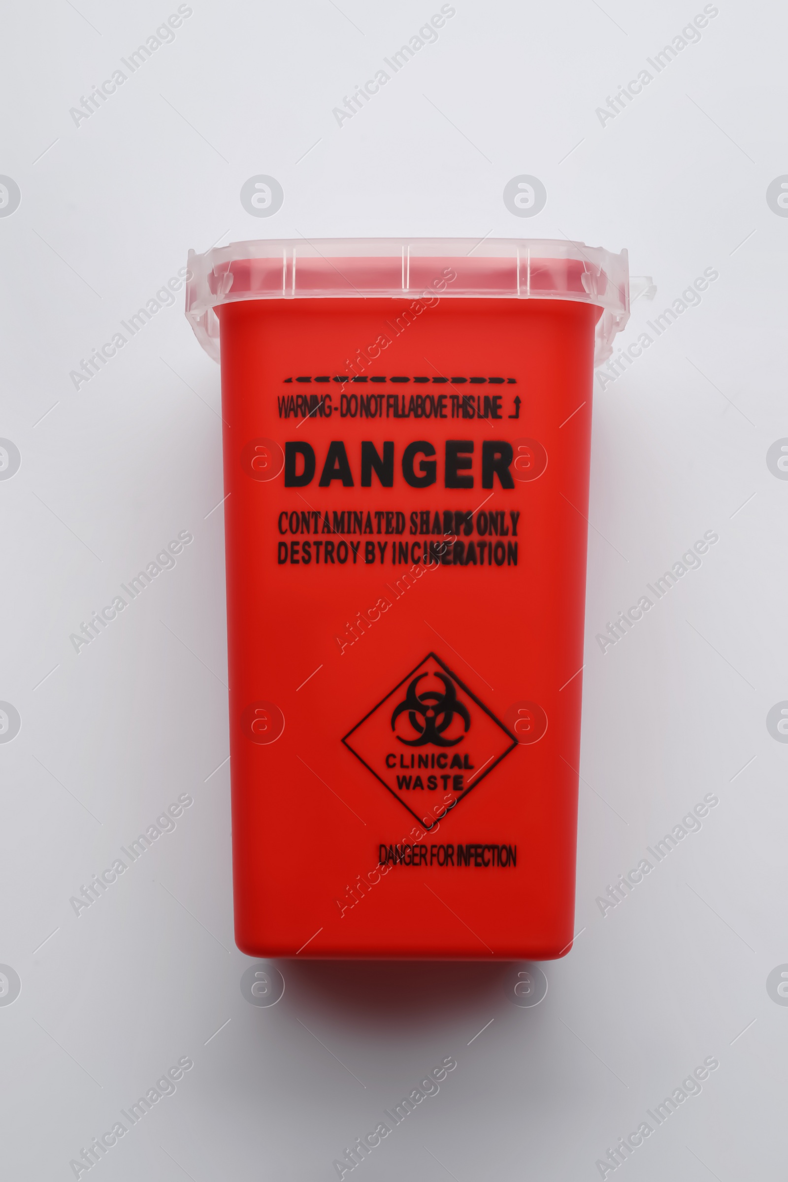 Photo of Sharps container for used syringe on white background, top view