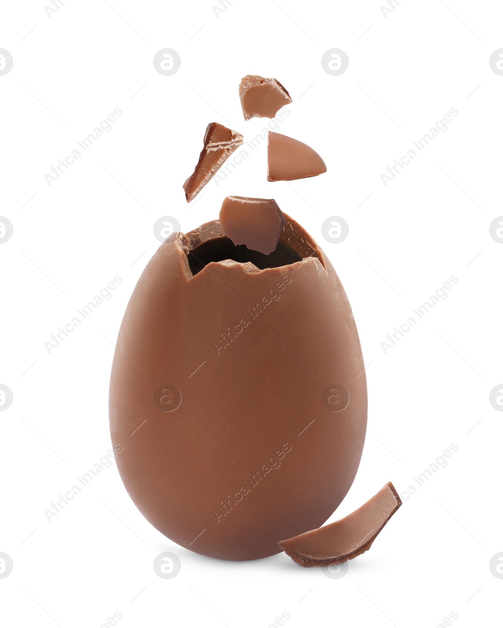 Image of Exploded milk chocolate egg on white background