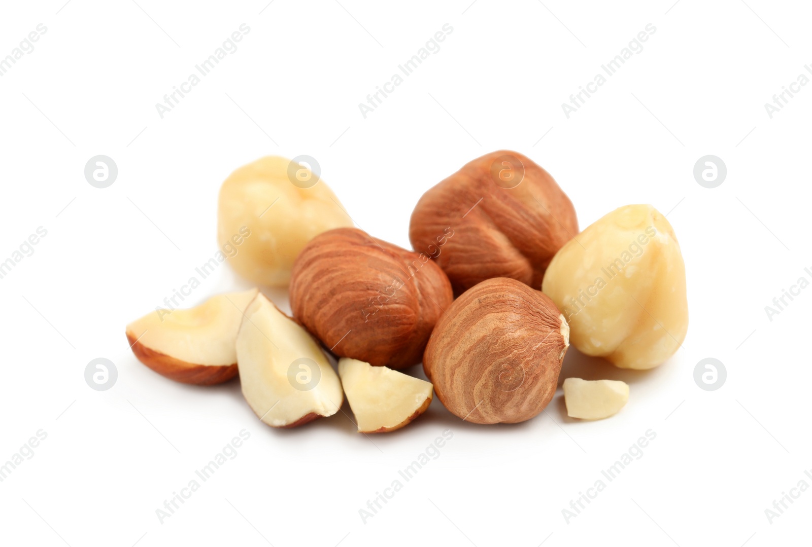 Photo of Heap of tasty hazelnuts on white background