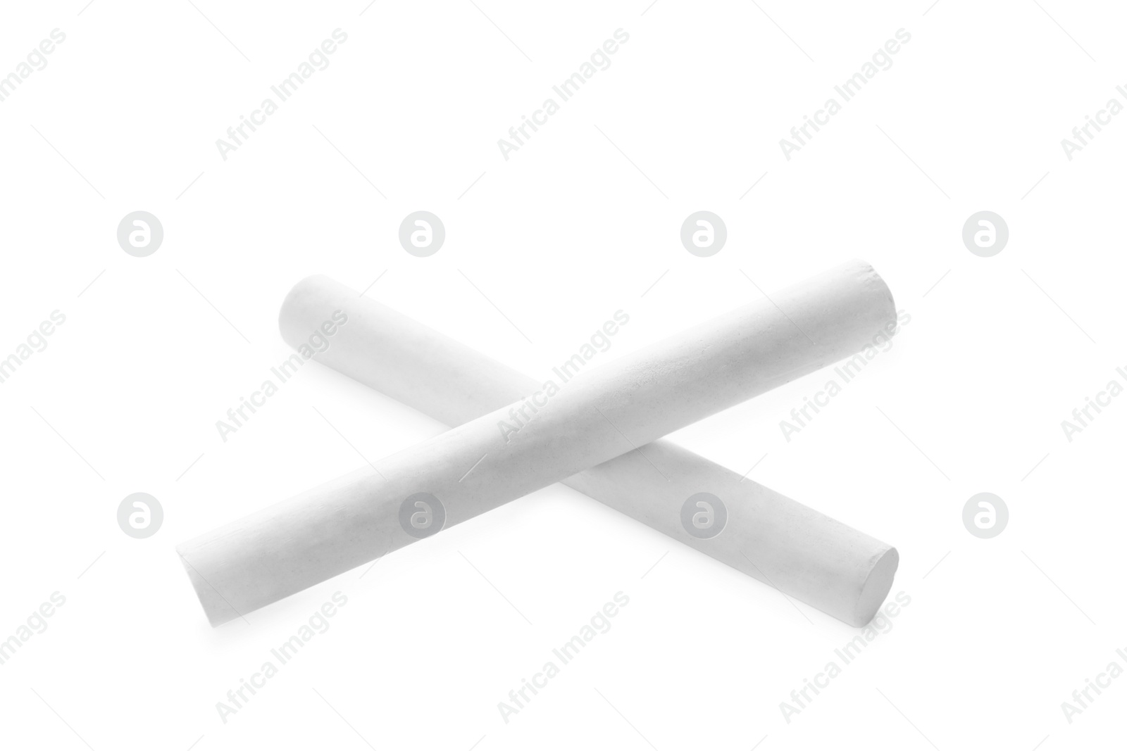 Photo of Small pieces of chalk on white background