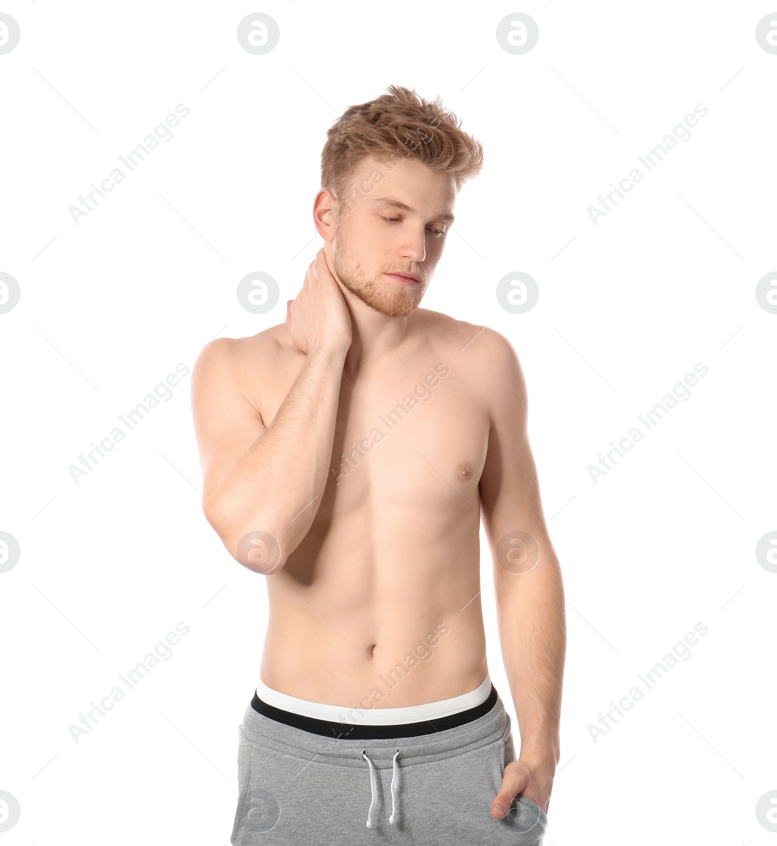 Photo of Portrait of young man with slim body on white background