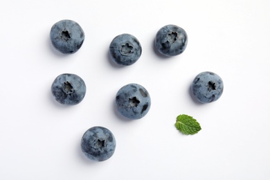 Flat lay composition with tasty blueberry on white background