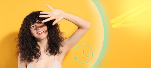Sun protection product (sunscreen) as barrier against ultraviolet, banner design. Beautiful young woman shading herself with hand on orange background